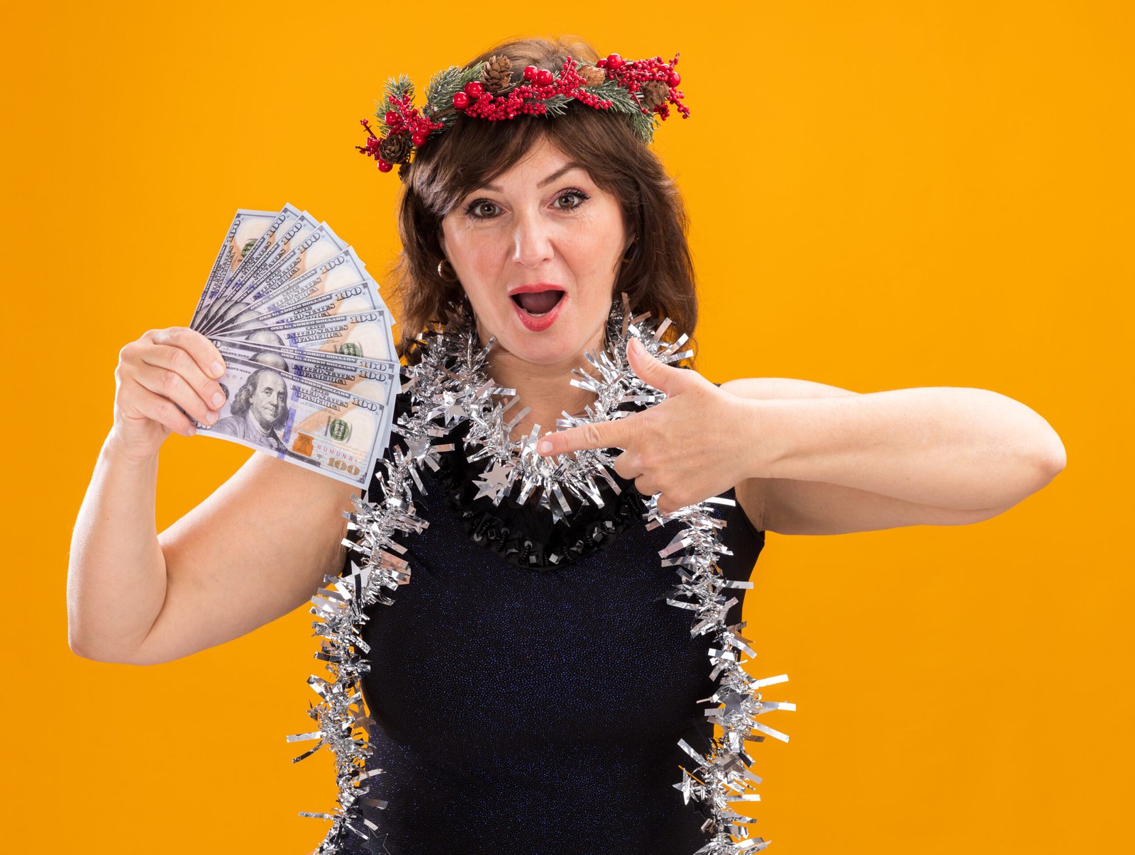 https://img.freepik.com/free-photo/impressed-middle-aged-woman-wearing-christmas-head-wreath-tinsel-garland-around-neck-holding-pointing-money-looking-camera-isolated-orange-background_141793-39791.jpg?t=st=1742588144~exp=1742591744~hmac=28682cac925815b30a134b575dfd194b5ec05d1e501745974daf5768a4b13e86&w=826